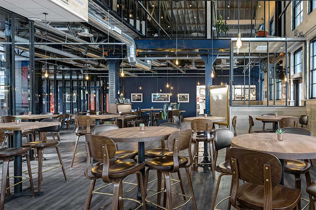 Holsag barstools in an industrial restaurant setting